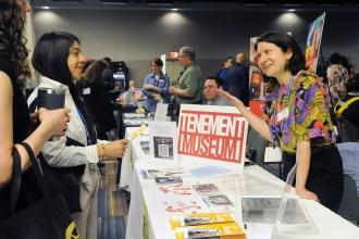 A representative from the Tenement Museum talks with guests at the 2025 UFT Spring Education Conference. 