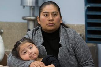 Mother holding child in her arms