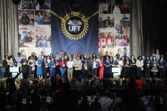 Elementary school chapter leaders gather on stage after receiving Ely Trachtenberg Awards for exemplary service from UFT Vice President for Elementary Schools Karen Alford (far left), Mulgrew and Barr (far right).