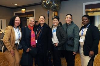 School counselors gather with Chapter Leader Rosemarie Thompson (second from left) during the lunch reception at the close of Teacher Union Day.