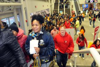 Throngs of members make their way inside the arena for the rally alongside other unionists from across the state.
