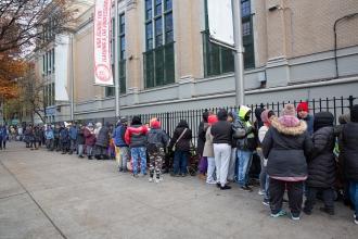 Families line up in the cold for hours, some as early as 5:30 a.m., for the Nov. 17, 2025, food pantry at International School for Liberal Arts in the Bronx.