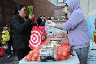 Fresh produce – onions, celery, carrots, broccoli, is a real draw for families at PS 14 in Corona, Queens, which is centered in a food desert.