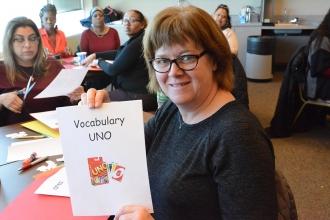 Woman holds up a sign, Vocabulary UNO
