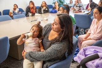 Parents listen intently as UFT health and safety representatives give a presentation at the UFT Bronx KidZone and Community Resource Fair on Oct. 4