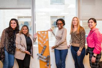 Attendees show off their group project at the 2024 UFT Early Childhood Conference. 