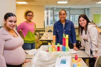 Early childhood educators show off their group project at the UFT's 2024 Early Childhood Conference