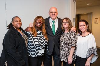 School nurses and UFT President Michael Mulgrew take a group photo at the 2024 UFT School Nurses Appreciation Dinner on May 8, 2024.