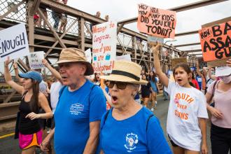 Retirees march in front of younger protesors 