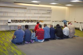 Attendees at the 2024 UFT Muslim Educators Committee pray together. 