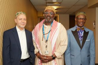UFT Muslim Educators Committee Chair Abdelhafid Djemil, District 9 Representative Aqeel Williams and Mohammed Bility, a committee member and teacher at IS 49 take a photo at the UFT Muslim Educators Committee 2024 Iftar Dinner 