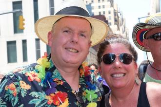 A man and woman pose together for a photo