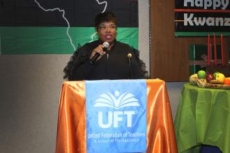 A woman speaking in front of an audience