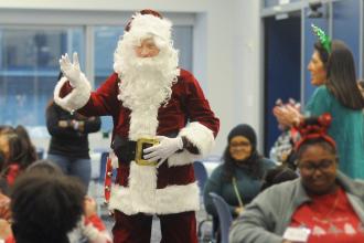 Santa Claus arrives to a kazoo-driven rendition of “Jingle Bells" at the UFT/Coalition for the Homeless holiday toy drive and celebration on Dec. 7, 2024. 
