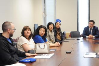 A group of UFT members talk with an assemblyman over co-location in public schools