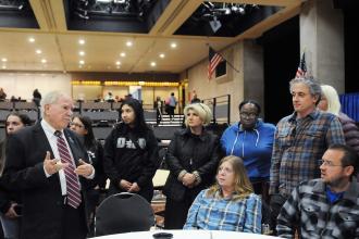 A group of UFT members talk with a Brooklyn assemblyman