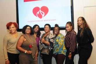 A group of nurses gather for a photo at a nurse celebration