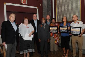 A group of retirees pose for a photo at the 2024 UFT Retired Teachers Chapter Luncheon.