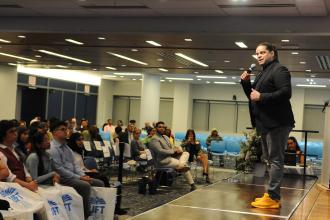 A speaker addresses the crowd during a scholarship ceremony