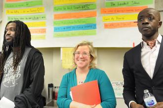 Woman looking on with colleagues 