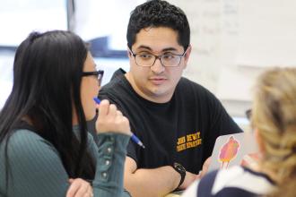 Two colleagues engage in a conversation.