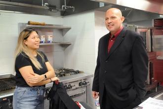 Mulgrew has a conversation in a class kitchen