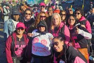 A group of UFT members at a Bronx breast cancer walk gather for a photo. 