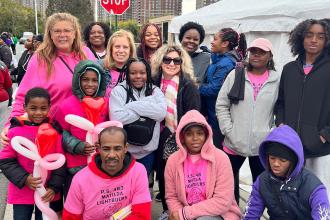 A group of marchers pose for a photo.
