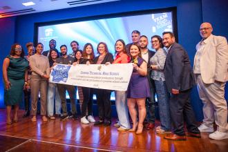 Members from Queens Technical HS are all smiles as they take home a Team High School Award.