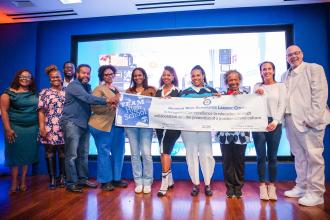 Beaming members from Brooklyn West Alternative Learning Center accept their Team High School Award.
