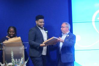 Man gives man a plaque