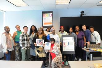Participants of the workshop titled, “School Safety Now: Discipline, Devices and the ‘Cool Schools’ Act,” smile for the camera with UF T presenter Katrina Foye kneeling at the center during the UFT Brooklyn Parent Conference on Oct. 25, 2025. 