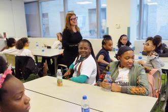 Group of students and teacher in classroom