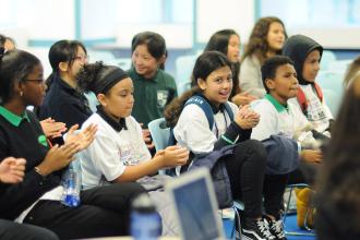 Group of students clapping