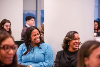 School psychologists Annmarie Christopher of PS 627 in Brooklyn 16K627 and Suginia Jones of PS 230 in Brooklyn share a laugh during Clinician Appreciation Day at UFT headquarters on Jan. 27, 2025. 