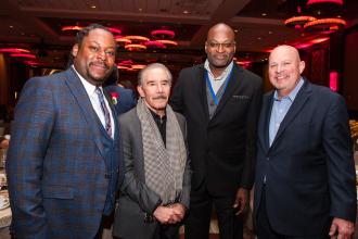 Frank Carucci, a former UFT vice president for CTE high schools who received the UFT Legacy Award, is congratulated by (from left) Gordon, former UFT VicPresident for CTE High Schools Sterling Roberson and Mulgrew at the 2025 UFT Career and Technical Education Awards at the Sheraton New York Times Square Hotel on Feb. 26, 2025.