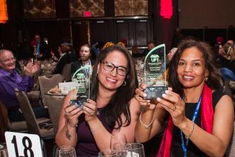 Teachers Corissa Martinez (left) and Irma Gianni of IS 145 in Queens hold up special recognition awards at the 2025 UFT Career and Technical Education Awards at the Sheraton New York Times Square Hotel on Feb. 26, 2025.