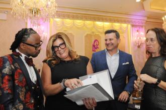UFT District 11 Representative Dana Falciglia (second from left), greets guests as they arrive to the 2025 UFT District 11 Scholarship on March 28, 2025.