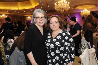 Teresa DiBari, a paraprofessional at PS 483 in the Bronx who received an award at the 2025 UFT District 11 Scholarship Dinner, is joined by her sister, retired teacher Nikki DiBari-Vasquez.