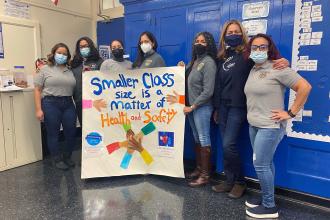 Educators from PS 115 in Manhattan put their hands together for smaller classes.