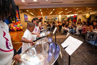 Students from PS 66, PS/IS 155, PS 41, and Mott Hall IV of Brooklyn, all members of the “Science of Music” program, perform on the steel drums for attendees at the 2025 UFT Early Childhood Conference. 