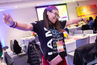 A UFT member in attendance is photographed while dancing at the HERstory brunch on March 15, 2025. 