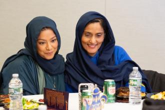 Two teachers from PS 223 in Queens take a selfie to capture memories at the UFT Muslim Educators Committee Dinner on March 7, 2025. 