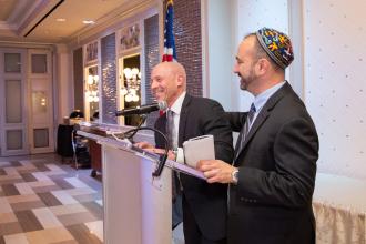 UFT Vice President for Middle Schools Richard Mantell (left) and UFT Jewish Heritage Committee Chair Jason Goldberg share a laugh during the presentation of the Tikkun Olam Award.