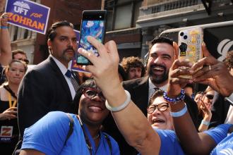 Members take selfies with UFT-backed New York City mayoral candidate Zohran Mamdani as he stops by the UFT staging area near the start of the 2025 NYC Labor Parade