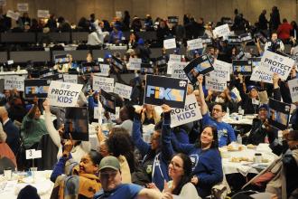 Energized UFT Lobby Day participants display placards about protecting children and fixing  Tier 6 as they prepare to lobby their legislators in groups at Lobby Day in Albany on March 10, 2025. 