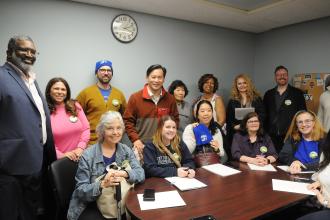 After sharing their concerns with state Assembly Member Ron Kim (standing, 4th from left), members from District 25 in Queens pose for a photo.