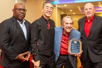 an C. Thom Award winner Alan Lubin (second from right), a former NYSUT vice president and UFT district representative, poses with (from left) UFT Secretary LeRoy Barr, UFT Asian American Heritage Committee Chair Seung Lee and UFT President Michael Mulgrew at the committee's Lunar New Year Banquet on Feb. 28, 2025. 