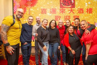 UFT members from District 32 smile for the camera at the UFT Asian Heritage Committee Lunar New Year Banquet on Feb. 28, 2025. 