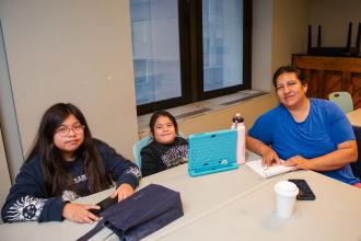 Erika Sarmiento, a Manhattan parent, attends a training on school leadership teams, parent-teacher associations and safety teams with her two children.